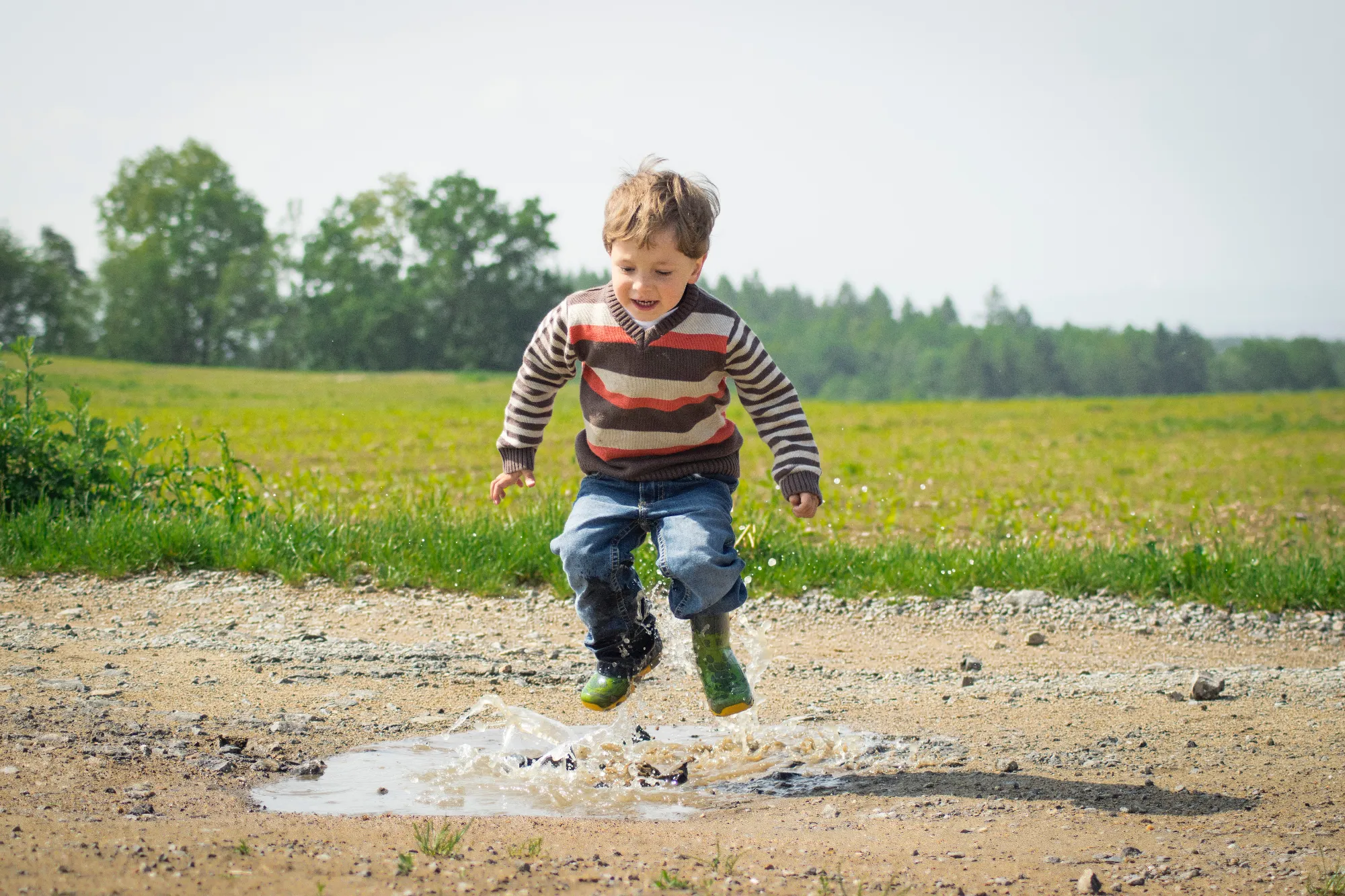 boy-jumping-near-grass-at-daytime-1104014-1.webp